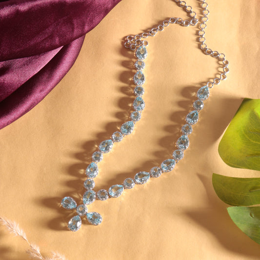 Dazzling Blue Topaz Cross Drop Necklace in Sterling Silver