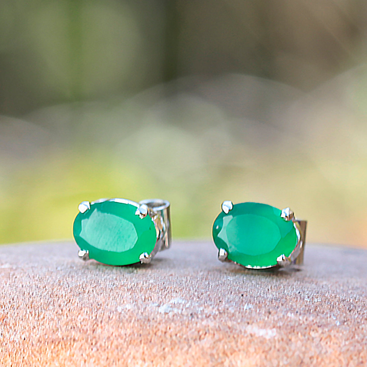 925 Silver Eartops with oval faceted Green Onyx Gemstone in prongs setting with push closure.