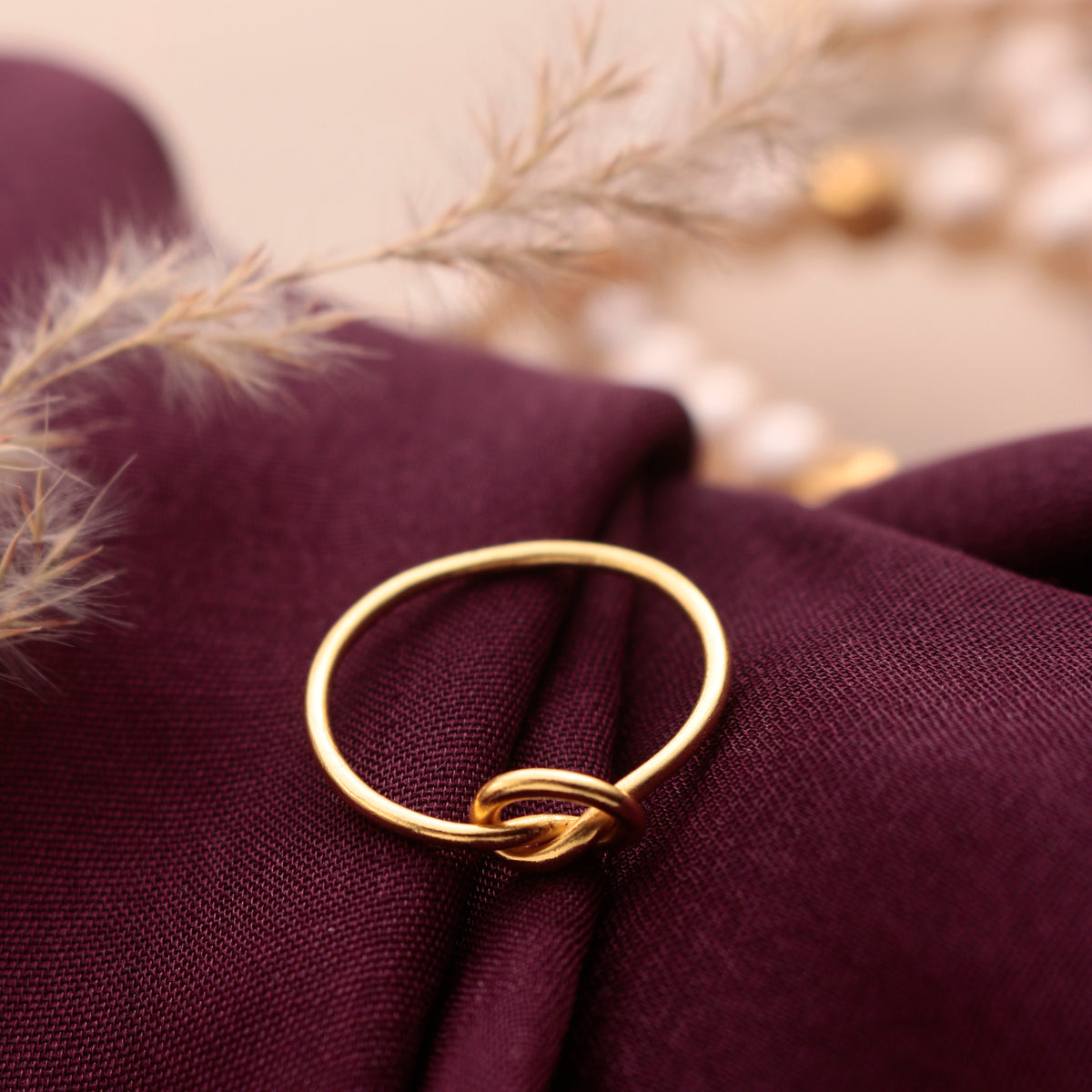 925 Silver Handmade Ring in knot design with Gold Plating with a delicate light weight band.